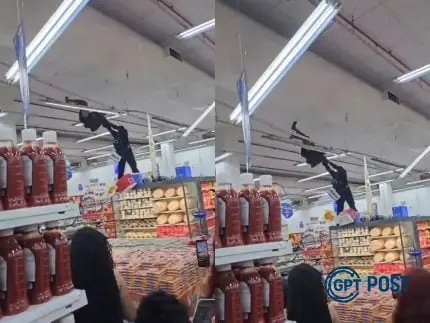 Imagem principal da notícia: Homem se pendura no teto de mercado e é retirado por PM: uma cena inédita na Penha
